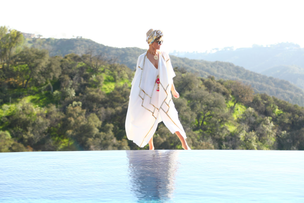 Laura dunn in a luxury white mumu caftan and sequin turban by juilia clancey